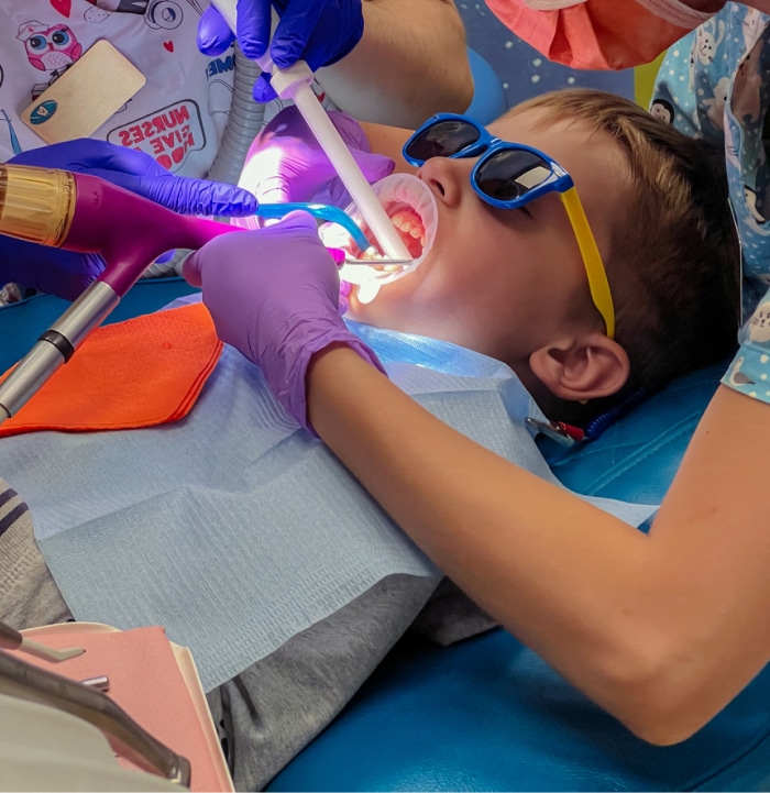 Young child with safety goggles, getting general anesthesia done.